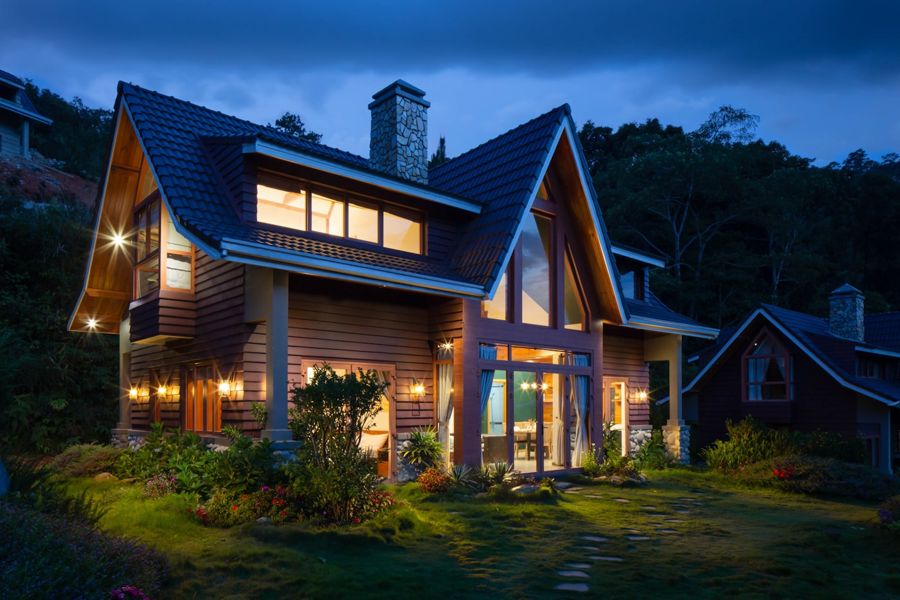 Craftsman home lit at evening